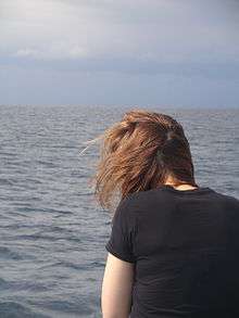 A young woman with brown hair.