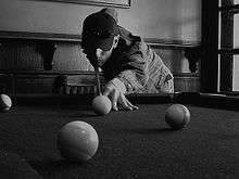 Concentration d'un joueur de billard.