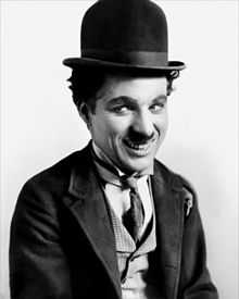 Chaplin in his costume as "The Tramp"